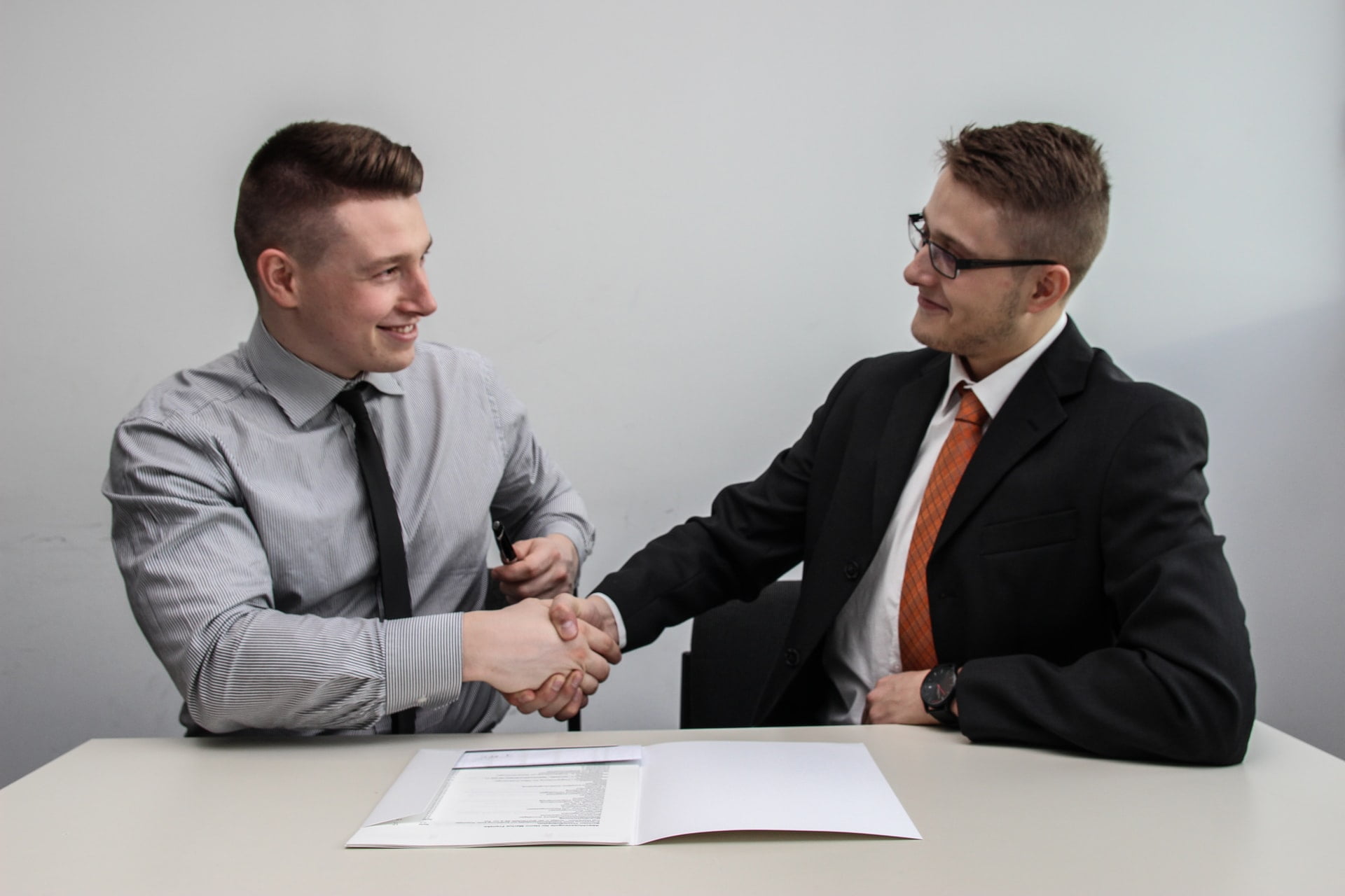 2 men shaking hands